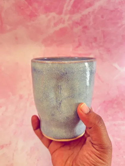 The simple, elegant form of this grip mug is designed to highlight the beauty of the glaze.