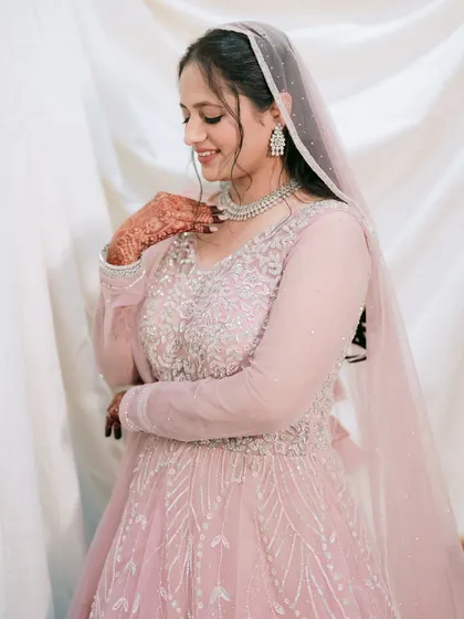 A close-up portrait capturing the delicate details of Muskaan's gown and her gentle smile.