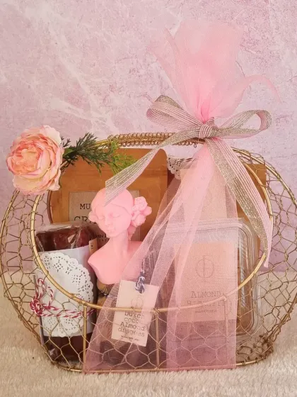 This beautifully arranged wire basket hamper is another example of our elegant gifting options. It's filled with a variety of our best-selling treats and decorated with a delicate floral touch.