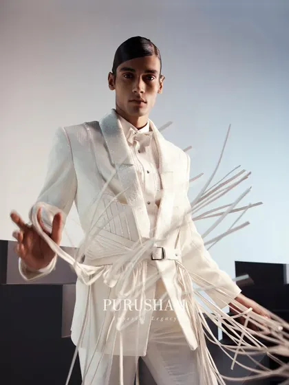 The movement of the fringes on this belted white jacket adds a dynamic, playful element to a sharp, tailored look. It is a vibrant ode to the sun-kissed season.