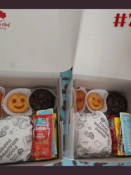 My snack boxes are designed to make great moments even better. This box for kids includes a mini burger, smiley fries, a chocolate muffin, and other treats.