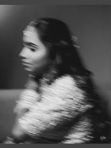 An artistic, motion-blur portrait of the bride in black and white. This creative shot adds a sense of movement and fine-art flair to the bridal gallery.