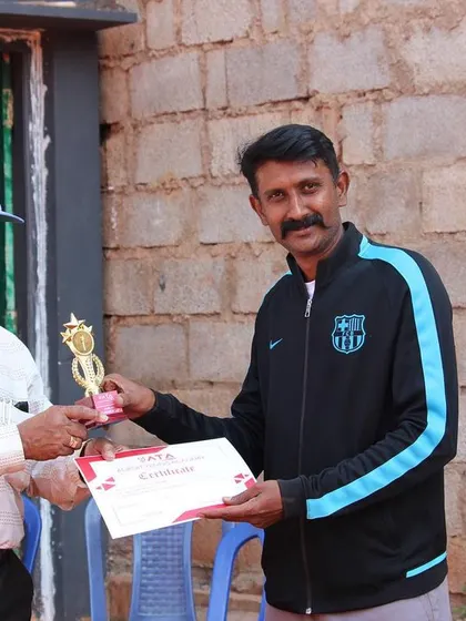 A player receives his trophy and certificate after a strong performance. We make sure to recognize the effort and dedication of every competitor.
