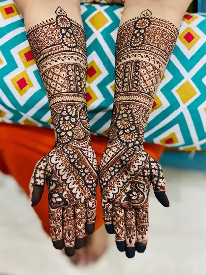 An elegant Indo-Arabic design with a mix of bold paisleys and delicate filler patterns.