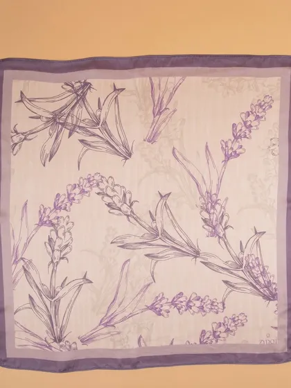 A flat-lay of the lavender floral pocket square, detailing the delicate line-art pattern.