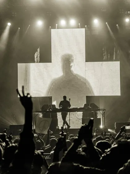 A black and white shot that captures the raw, timeless energy of a live concert.