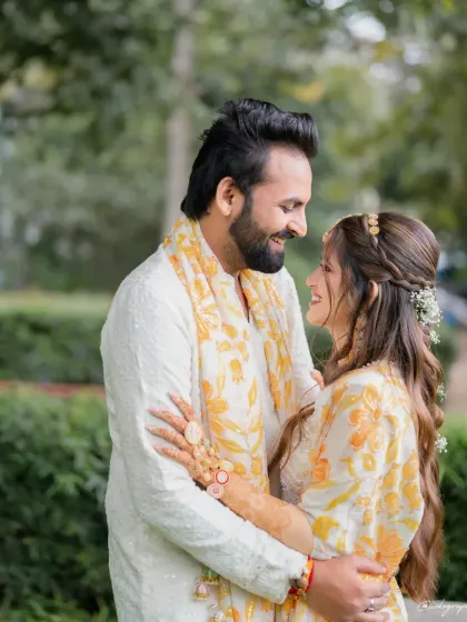 A happy couple sharing a quiet, loving moment during their outdoor Haldi ceremony. I focus on creating a relaxed environment where you can truly enjoy these special times together.