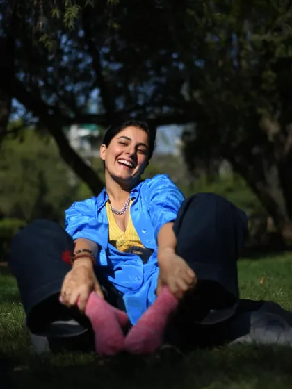 A joyful, sun-drenched photo of Isha Talwar laughing in a park. Capturing pure, uninhibited happiness is one of my favorite things.