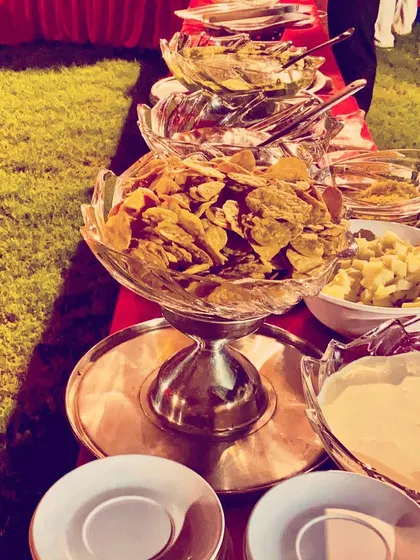 A fresh salad and nacho bar from an outdoor event. I always provide healthy and light options for guests to enjoy alongside the main courses.