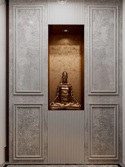 A close-up of the central niche within the hidden storage wall. The textured gold-leaf background and focused spotlight create a serene and luxurious focal point.