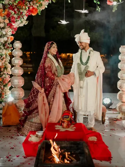 The sacred pheras around the holy fire, set against a backdrop of floral elegance. I ensure every ritual is conducted in a setting that is both beautiful and meaningful.