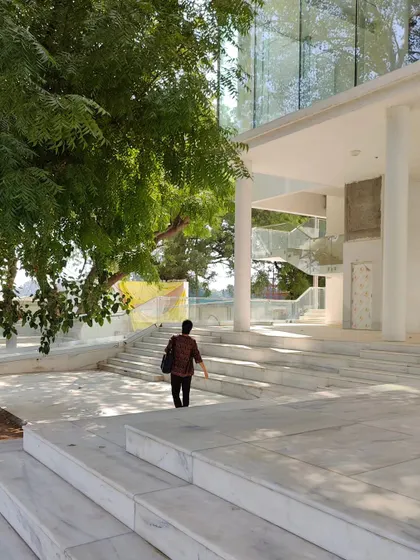 Glimpses of our ongoing project for the Koba Jain Museum. The pristine white structure is lifted on stilts and nestled among existing trees, creating a serene pavilion that invites community interaction and feels light upon the earth.