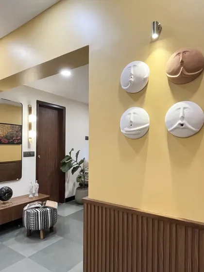 A repeat of the mustard yellow statement wall, showcasing its bold and artistic impact from a different angle.