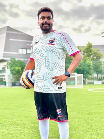 Coach Ashwin, whose kind nature and dedication are loved by all players.