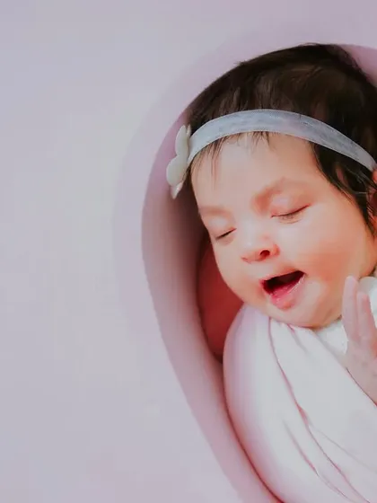A sleepy yawn from a brand new baby girl. These unposed, real moments are what make newborn sessions so special.