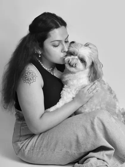 A quiet kiss for a beloved Shih Tzu. I've photographed this family since I started my career, and capturing their bond in this classic black and white style for Mother's Day was an honor.