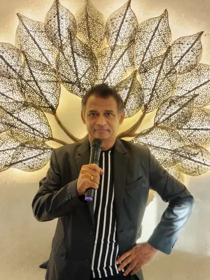 Dressed and ready with the mic in hand. This is my classic look, prepared to bring professionalism and high energy to your event, no matter the setting.
