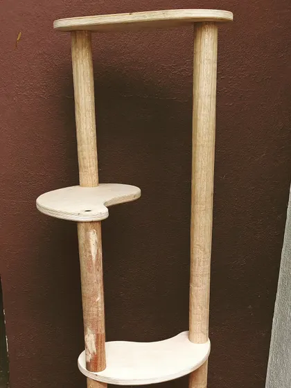 Another view of a cat tree in progress. This one is made from solid wood pillars and plywood platforms, designed to be both sturdy and stylish.