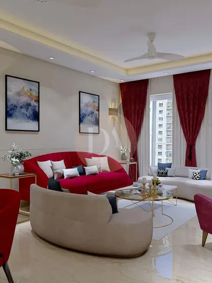 Another perspective of the Gurgaon villa living room, showing the interplay of red and beige furniture. The design feels warm and dramatic, perfect for both relaxing and entertaining.