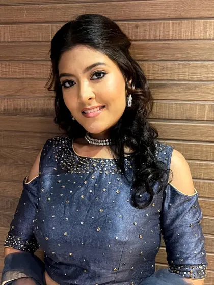 A smiling portrait of the model, showing how the simple yet elegant makeup enhances her features beautifully.