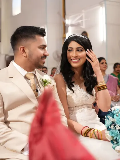 A candid moment during the ceremony. The bride's smile is so genuine and happy, and her classic look is simply timeless.