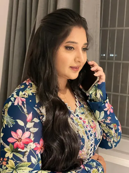 A candid shot of my client Sripriya. This shows how natural the makeup looks even in an unposed, everyday moment.