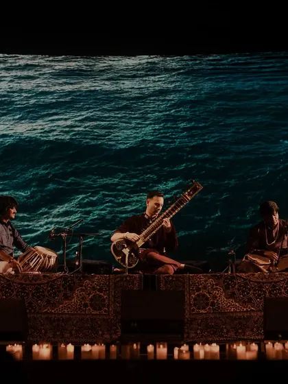 The ocean-themed backdrop for a performance, symbolizing depth, flow, and tranquility.