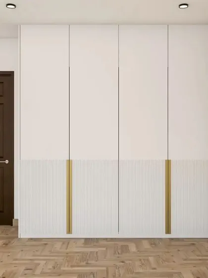 This two-tone wardrobe design combines a smooth white finish with a lower fluted panel section, creating a balanced and stylish look.