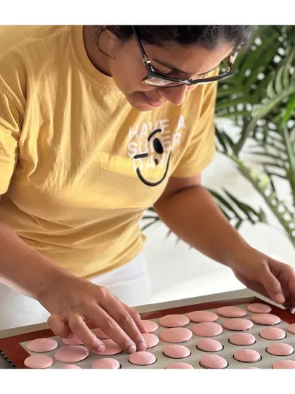 This is me, Ritu, having a moment of intense focus while trying to make the perfect macarons. It's a reminder that baking is a journey of learning and joy.