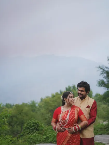 A romantic portrait with the vastness of the mountains behind them. The soft light and natural setting make this a truly timeless pre-wedding photograph.