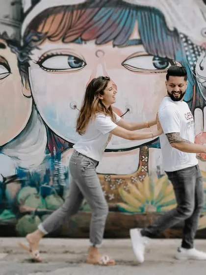 A fun and quirky shot of Harman and Komal in front of colorful street art in Phuket. It shows that we can find amazing photo opportunities anywhere, not just in nature.