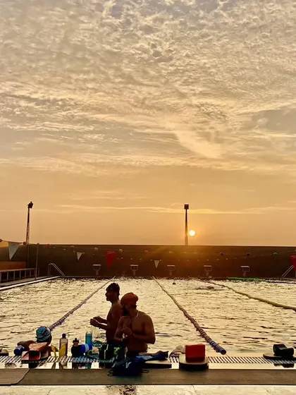 There's a special kind of peace during early morning workouts. Catching the sunrise at the pool is one of the simple joys our swimmers experience.