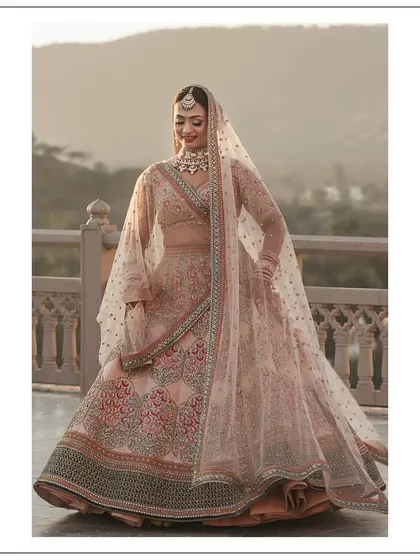 A closer look at Somya's wedding lehenga. The delicate net dupatta with scattered motifs and the detailed craftsmanship on the skirt came together to create a look of pure elegance. It was a joy to help her find an outfit that made her feel so radiant.