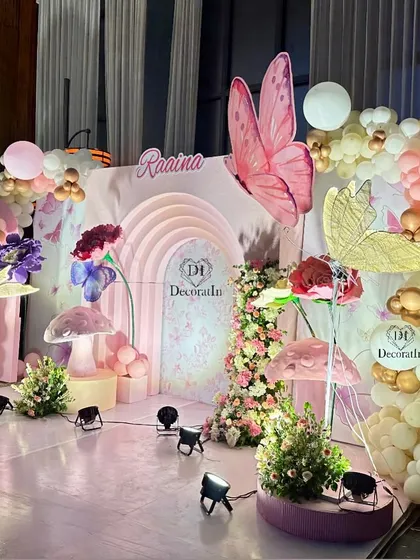 Another perspective of the beautiful stage, highlighting the mix of textures from balloons, flowers, and custom props.