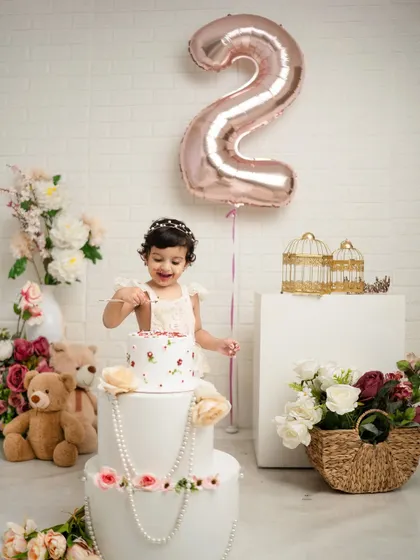 The moment she finally gets to taste the cake. Capturing these key moments of a second birthday celebration is what I do best.