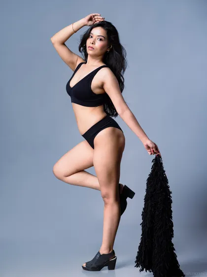 A three-quarter shot of the model, with a dynamic and engaging pose.