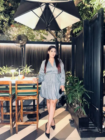 The satin-like fabric of this mini dress gives it a subtle sheen, making it feel extra special.