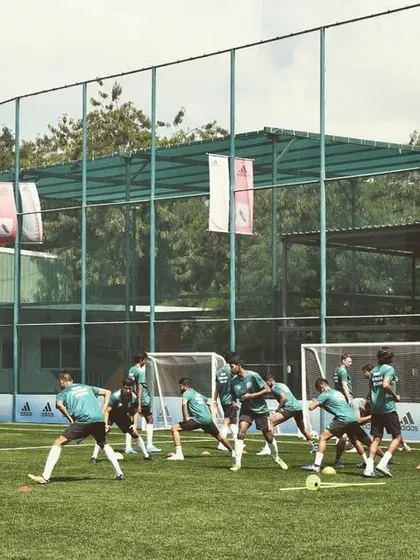 Another angle of our players during a dynamic warm-up, showcasing the entire squad moving in unison. Discipline and coordination are key elements of our training.