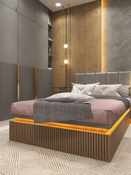 A modern bedroom with a floating bed that features under-glow lighting. The room uses a sophisticated palette of grey, wood, and pink, with textured wall panels and pendant lights adding layers of interest.