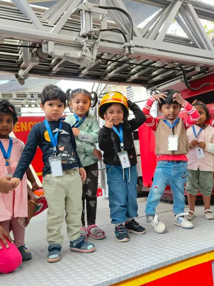 Standing on the fire truck was an unforgettable experience. These hands-on interactions make learning about community helpers engaging and real for the children.