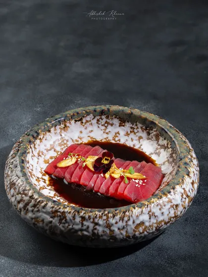 Tuna Sashimi with a ponzu dressing, elegantly plated in a stone bowl for the Zarin menu at Fairmont Jaipur.