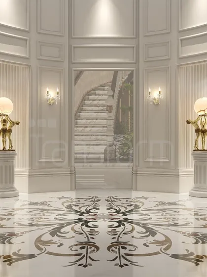 An entryway defined by its intricate marble inlay floor and classical wall paneling. The symmetrical placement of sculptural lamps on pedestals creates a powerful statement of refined, artistic living.