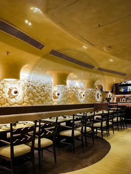 A view of the bench seating and chairs we provided for 'Call Me Ten'. The continuous bench seating maximizes space while maintaining the unique, organic feel of the restaurant's design.