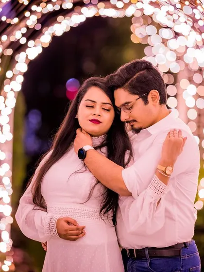 An intimate and emotional moment inside the tunnel of lights. The warm glow illuminates the couple's embrace, creating a soft, romantic, and heartfelt portrait.