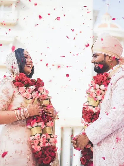A shower of rose petals for the happy couple, Ayushi and Abhiram, after their ceremony.