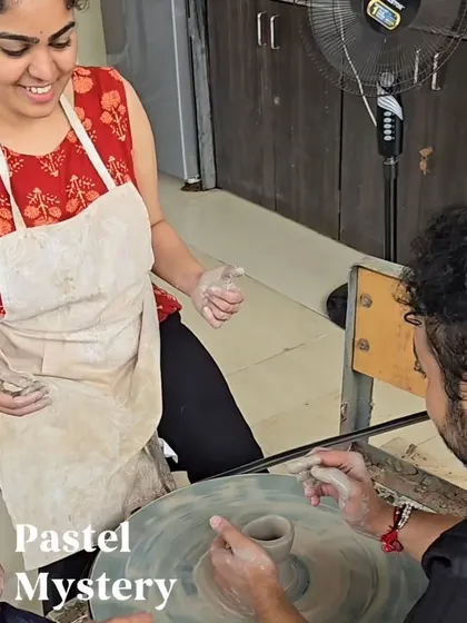 Our instructors are always on hand to help. Here, we are guiding a guest through the initial steps of shaping his pot, ensuring a fun and stress-free learning environment for everyone.