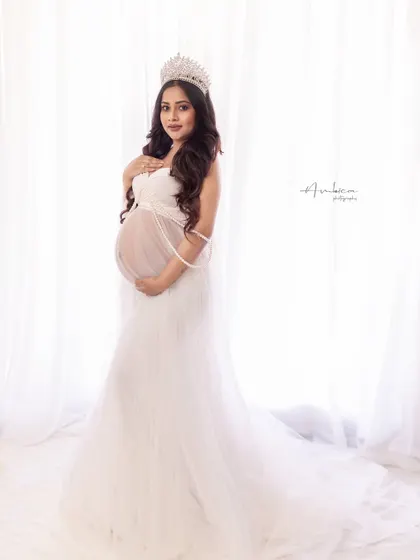 A direct and confident portrait from the "Queen" session. Her poise and the stunning styling come together to create a powerful and beautiful image of motherhood.
