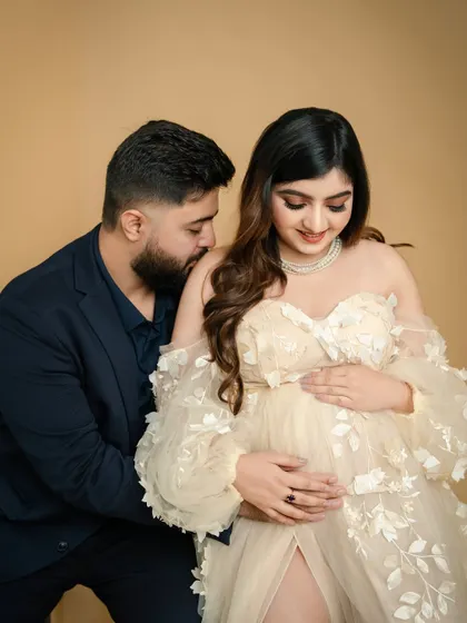 A shared secret. This pose, with the partner leaning in close, creates an intimate and romantic portrait of the couple's shared journey.