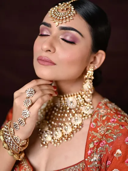 A close-up with eyes closed, focusing on the soft and romantic eyeshadow blend. This is a perfect example of subtle yet impactful bridal makeup.
