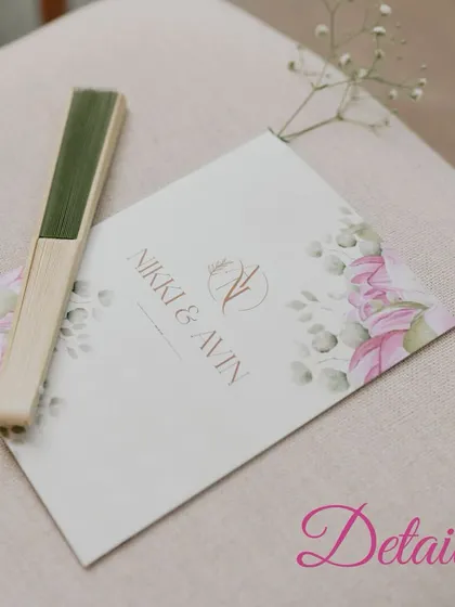 Another view of the personalized wedding stationery for Nikki & Avin, placed on a guest's chair. This shows how I integrate these details seamlessly into the event setup.